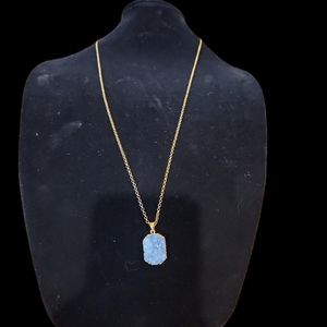 34 inch goldtone chain necklace woth crystallized lavender colored stone on pend